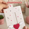 Une carte de Saint-Valentin faite main avec des cœurs en papier sur fond rose.