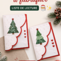 Une collection de cartes de Noël faites main sur une table, illustrant la créativité.